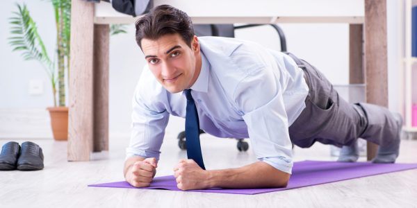 Businessman,Doing,Sports,In,Office,During,Break