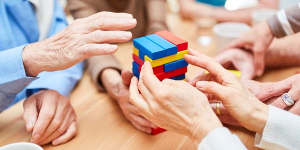 Group,Seniors,With,Dementia,Builds,A,Tower,In,The,Nursing