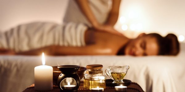 Aroma,Spa.,Woman,Enjoying,Massage,In,Luxury,Spa,With,Candle