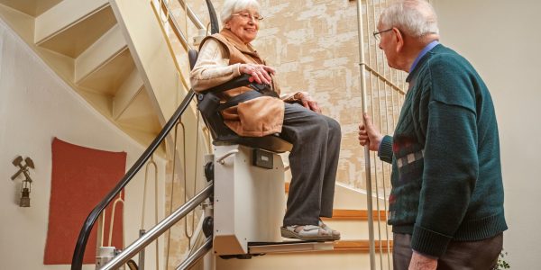 Elderly,Couple,In,The,Staircase,With,Stairlift