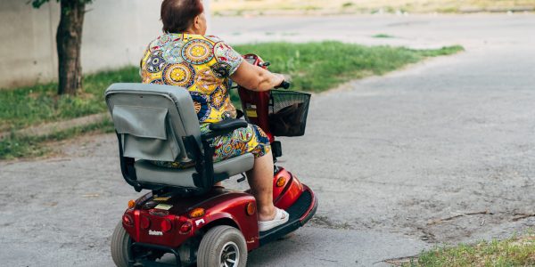 Poltava,,Ukraine,-,July,2020,Elderly,Woman,On,E-mobile,Vehicle