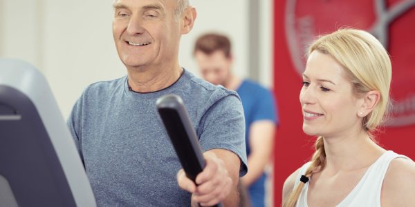 Elderly,Man,Working,Out,At,A,Gym,Monitoring,His,Progress