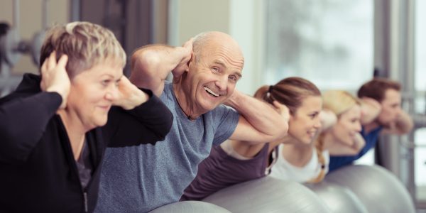 Elderly,Couple,Doing,Pilates,Class,At,The,Gym,With,A